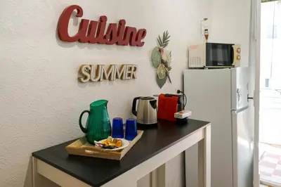 a kitchen with a counter with a refrigerator at Riviera Prom 4 Pers Vista Mare in Nice