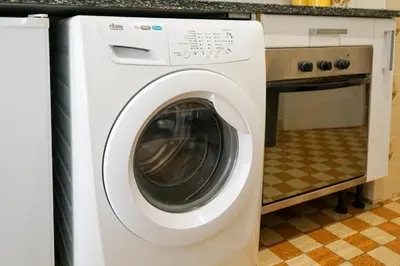 a white washer and dryer in a kitchen at Riviera Prom 4 Pers Vista Mare in Nice