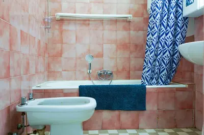 a bathroom with a toilet and a shower and a sink at Riviera Prom 4 Pers Vista Mare in Nice