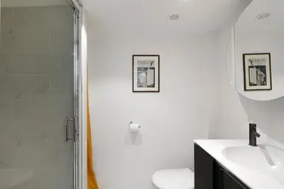 a bathroom with a shower and a toilet and a sink at Studio Jaune FSHH in Nice