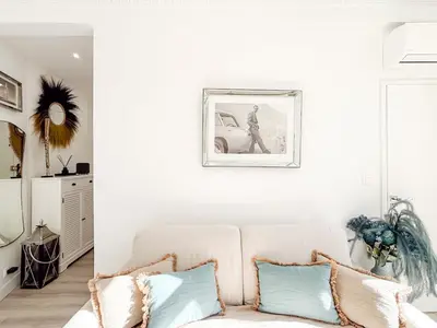 a living room with a couch and a picture on the wall at #12 1BDR Joffre, Central 5min from Old Town AC & WIFI in Nice