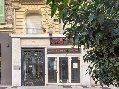 a building with a sign over the doors of a store at #12 1BDR Joffre, Central 5min from Old Town AC & WIFI in Nice