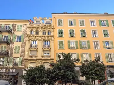 a large yellow building with a lot of windows at #12 1BDR Joffre, Central 5min from Old Town AC & WIFI in Nice