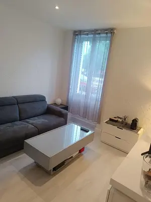 a living room with a couch and a coffee table at Appart in Nice