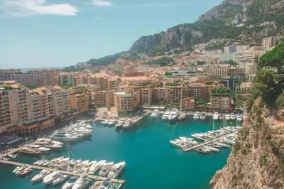 a bedroom with a bed and a chair and windows at Nice - Beautiful bright apartment - 10 min beach in Nice