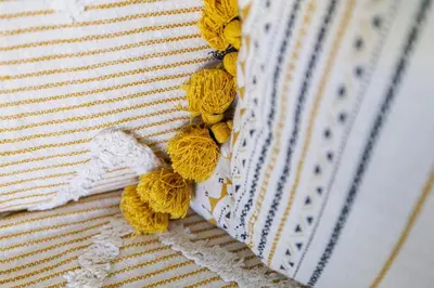 a group of yellow yarn on a white blanket at Nice Luxury in Nice