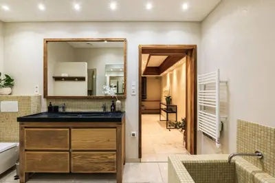 a bathroom with a sink and a mirror at Elegance, serenite et vue exeptionnelle sur la rade in Villefranche-sur-Mer