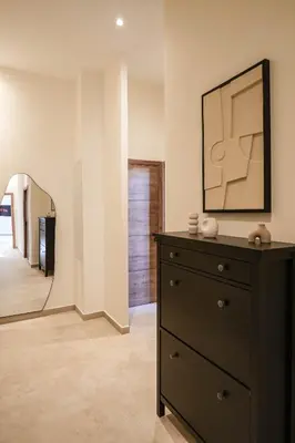 a dresser in a room with a mirror and a dresser at Massena Infinity in Nice
