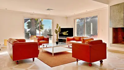 a living room with two couches and a table at Palm & Sun in Nice