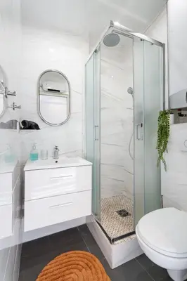 a bathroom with a shower and a toilet and a sink at Cocon Place Massena, Cours Saleya et Mer in Nice