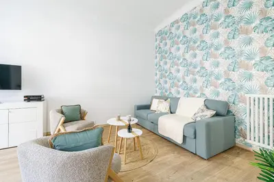 a living room with a couch and two chairs at 36 STALNGRAD - Appartement spacieux - Le Port - 6 pers in Nice