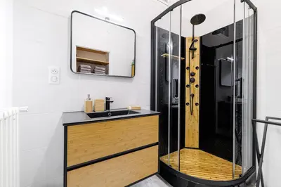 a bathroom with a shower and a sink at 36 STALNGRAD - Appartement spacieux - Le Port - 6 pers in Nice