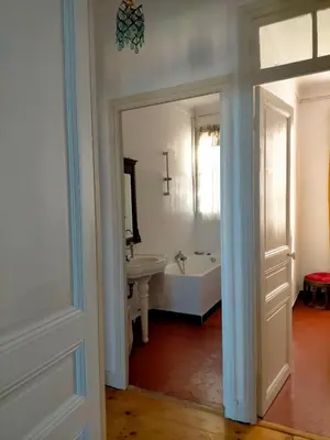 a bathroom with a white tub and a sink at L'Essentiel à Nice in Nice