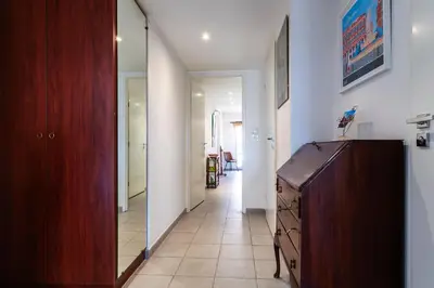 a hallway with a wooden dresser in a room at Jardin Wilson AP4455 by RIVIERA HOLIDAY HOMES in Nice