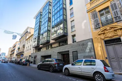 two cars parked on the side of a city street at Jardin Wilson AP4455 by RIVIERA HOLIDAY HOMES in Nice
