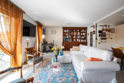a living room with a white couch and a table at Jardin Wilson AP4455 by RIVIERA HOLIDAY HOMES in Nice