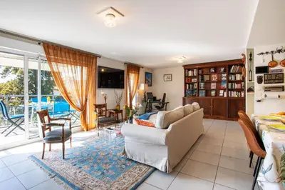 a living room with a couch and a table at Jardin Wilson AP4455 by RIVIERA HOLIDAY HOMES in Nice