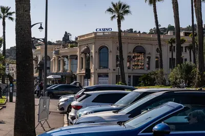 a line of cars parked in front of a building at Studio à 2min à pieds de la mer et du Casino in Beaulieu-sur-Mer