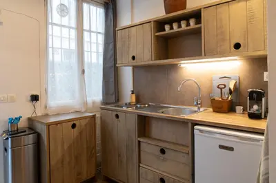 a kitchen with a sink and a counter top at Studio à 2min à pieds de la mer et du Casino in Beaulieu-sur-Mer