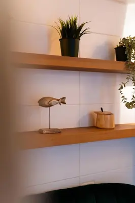 a kitchen with wooden cabinets and a sink at Studio à 2min à pieds de la mer et du Casino in Beaulieu-sur-Mer