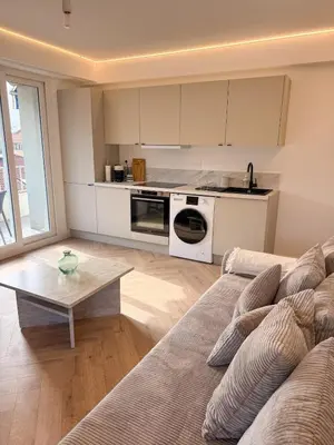 a living room with a couch and a table at appartement port de Nice 4pers emplacement idéal in Nice
