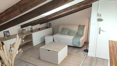a small bedroom with a bed and a table at Gubernatis centre ville in Nice