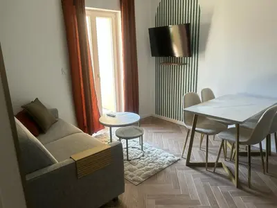 a living room with a couch and a table at MOON - 35 in Nice