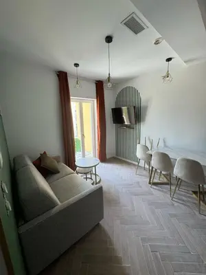 a living room with a couch and a table at MOON - 35 in Nice