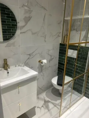 a white bathroom with a sink and a toilet at MOON - 35 in Nice