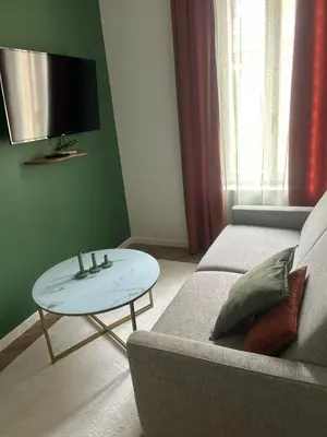 a living room with a couch and a coffee table at MASSENA 36 in Nice