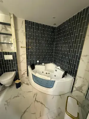 a bathroom with a bath tub and a toilet at MOON - 44 in Nice