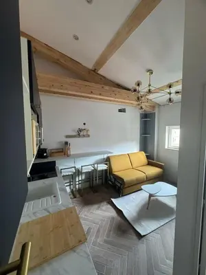 a living room with a couch and a table at MOON - 45 in Nice
