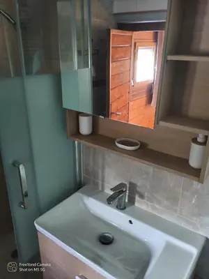 a bathroom with a sink and a mirror at Chalet at Villa Don Quijote Nice in Nice