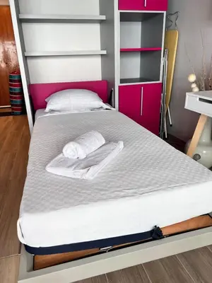 a bed with two towels on it in a bedroom at Studio at the heart of Carre D'or 2 mins Sea Wi-fi in Nice