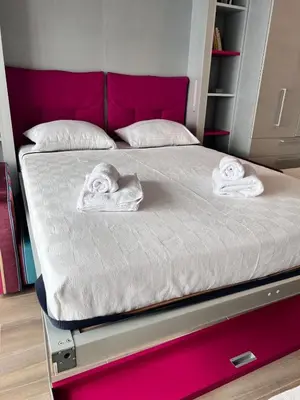 a bed with two towels on it in a room at Studio at the heart of Carre D'or 2 mins Sea Wi-fi in Nice