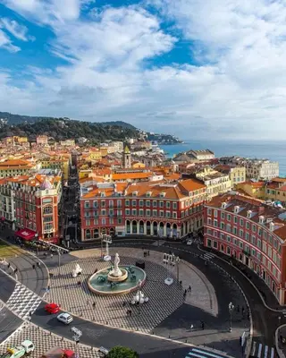 an aerial view of a city with buildings and a fountain at Noa house in Nice