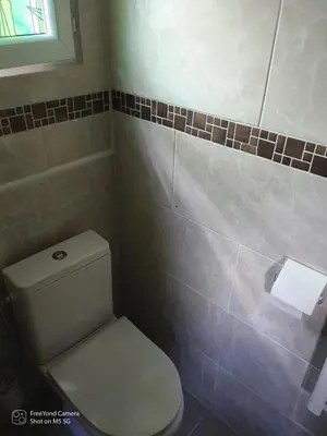 a bathroom with a toilet and a roll of toilet paper at Grand Chalet at Villa Don Quijote Nice in Nice