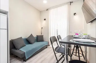 a living room with a couch and a table at 1 bed, center of Nice with AC in Nice