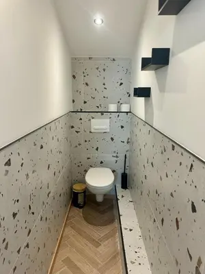 a bathroom with a white toilet in a room at GIOFFREDO SUITE in Nice