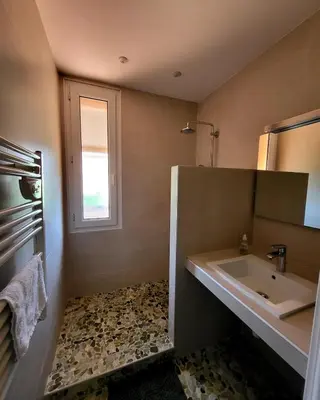 a bathroom with a sink and a window at Vacation location in Tourrette-Levens
