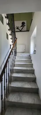 a staircase in a building with a stair case at Vacation location in Tourrette-Levens