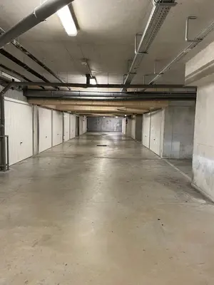 an empty parking garage with an empty parking lot at Nice modern flat in Nice