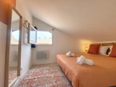 a bedroom with two beds and a window at Nestor&Jeeves - VIEUX NICE SUITE - Studio - Centre in Nice