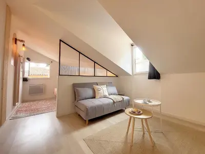 a living room with a couch and a table at Nestor&Jeeves - VIEUX NICE SUITE - Studio - Centre in Nice