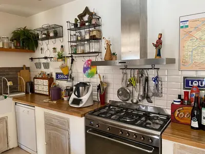 a kitchen with a stove and a counter top at Maison de ville avec jardin in Nice