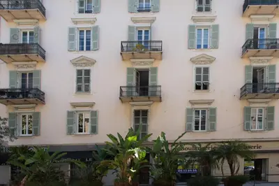 a tall white building with windows and balconies at GIOA- Studio avec balcon, place Garibaldi -Paillon in Nice
