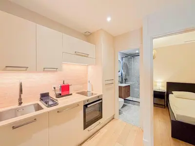a small kitchen with a sink and a bathroom at Petit cocon au cœur du Vieux-Nice, Wifi, AC, 2pers in Nice