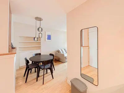 a dining room with a table and a mirror at Petit cocon au cœur du Vieux-Nice, Wifi, AC, 2pers in Nice