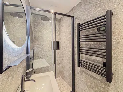 a bathroom with a shower and a sink with a mirror at Petit cocon au cœur du Vieux-Nice, Wifi, AC, 2pers in Nice