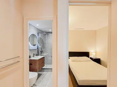 a bathroom with a bed and a shower and a sink at Petit cocon au cœur du Vieux-Nice, Wifi, AC, 2pers in Nice